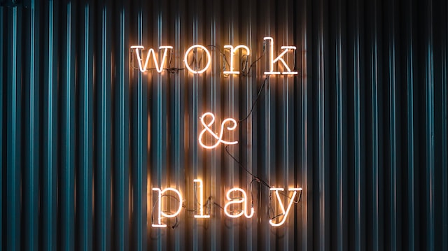 sign with the words work and play
